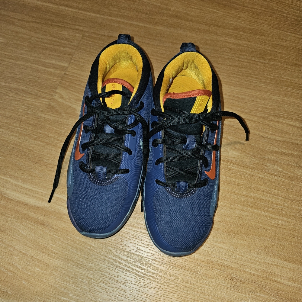 Nike Kids Navy Sneakers with Orange Swoosh and Yellow Lining